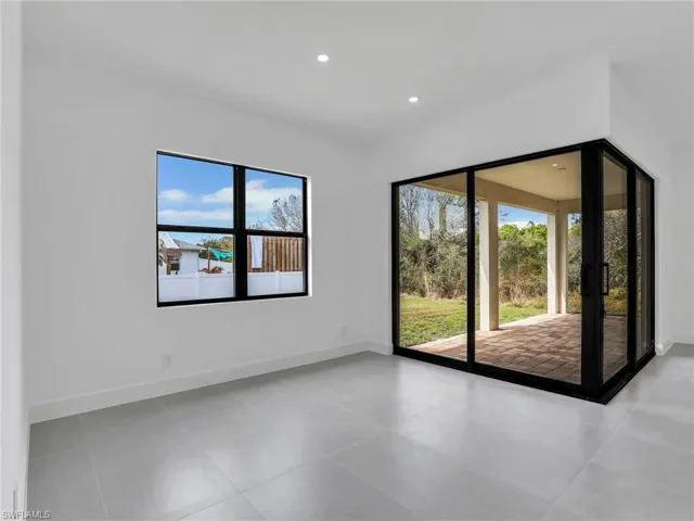 Empty room featuring plenty of natural light, recessed lighting, and light tile patterned floors