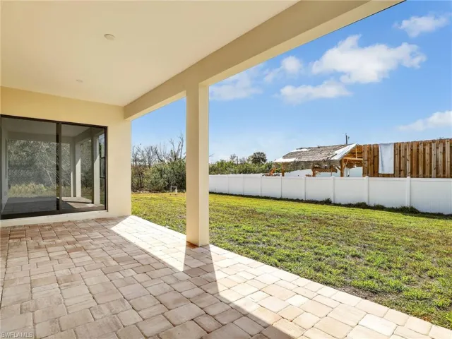 Fenced backyard featuring a patio area