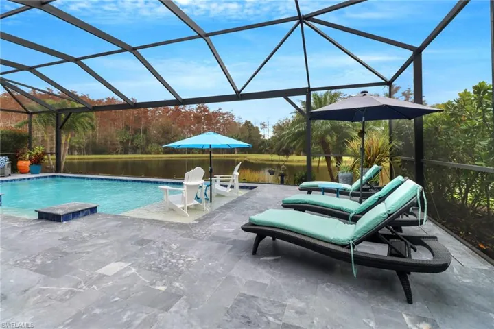 View of pool area featuring marble decking