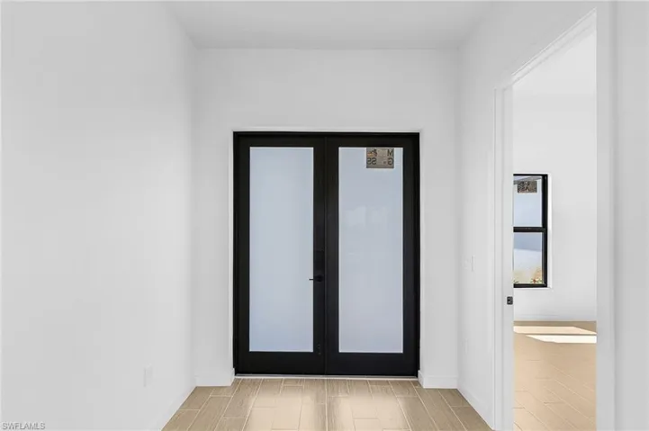 Doorway featuring french doors and light hardwood / wood-style floors