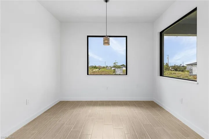 Spare room with light wood-type flooring