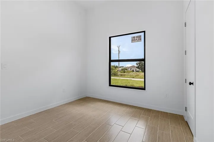 Unfurnished room with light hardwood / wood-style flooring