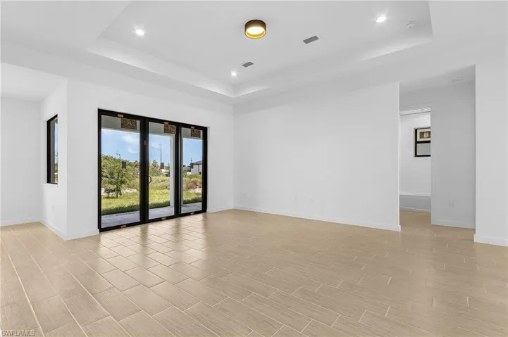Spare room with a raised ceiling