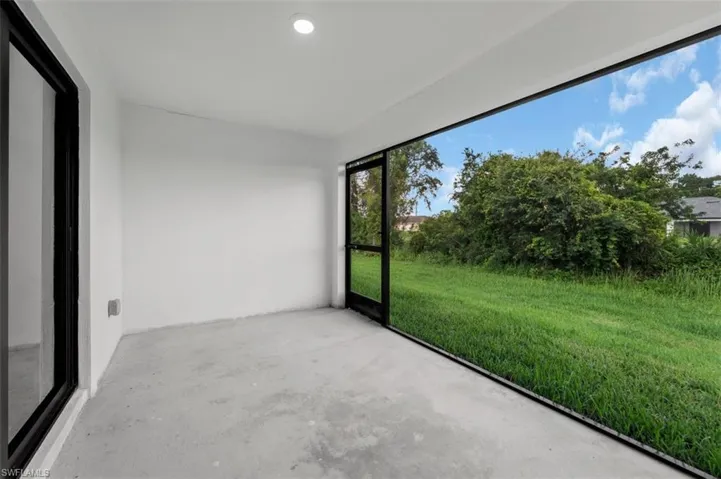 Screened patio featuring a concrete floor and white walls
