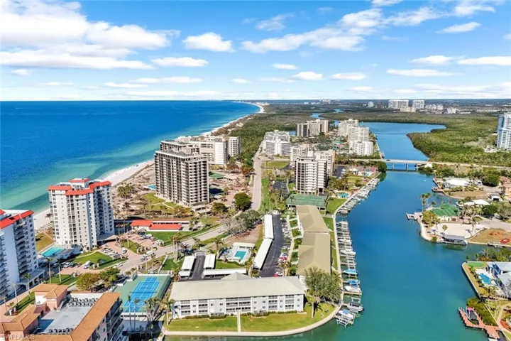 Drone / aerial view with a beach view and a water view