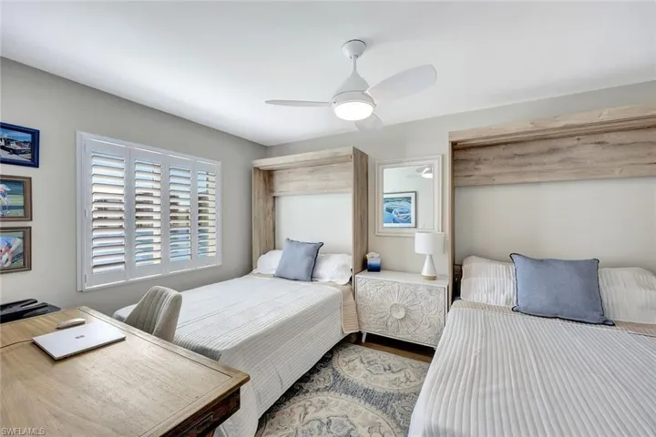 Bedroom with hardwood / wood-style flooring and ceiling fan