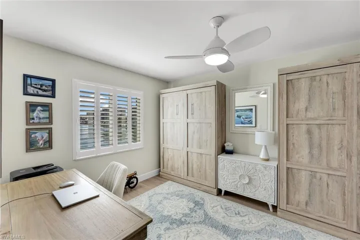Office area featuring hardwood / wood-style floors and ceiling fan