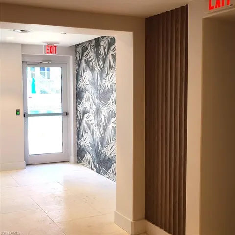 View from Elevators, Door to outside pool.  Accent wall.