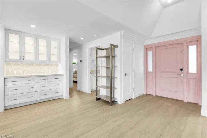 Foyer featuring light wood-type flooring and recessed lighting
