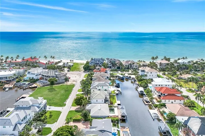 Aerial perspective of suburban area with a large body of water