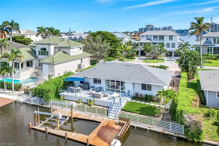 Dock area featuring a residential view, an outdoor hangout area, a fenced backyard, and a patio area