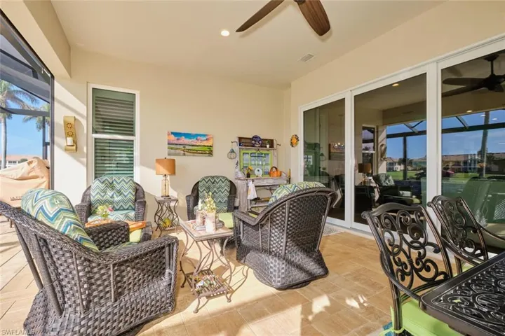 View of patio with outdoor lounge area and ceiling fan