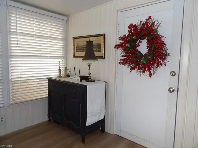 Detailed view of wood finished floors and wooden walls