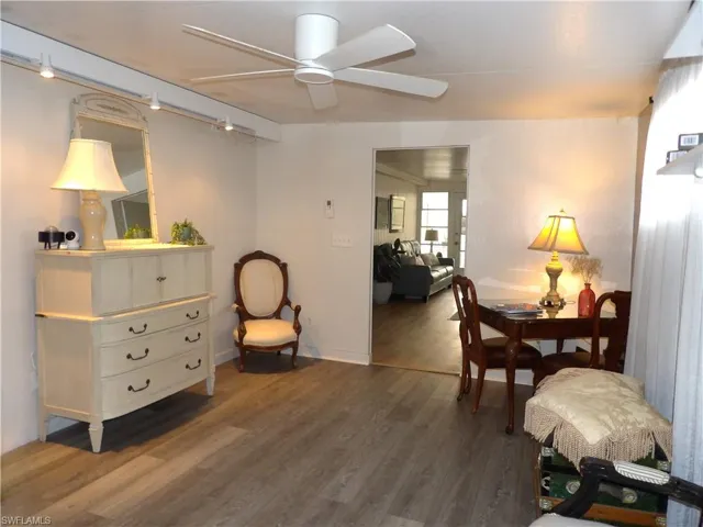Sitting room featuring wood finished floors and ceiling fan