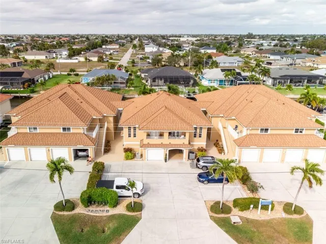 Aerial view of residential area. Unit is in the left building