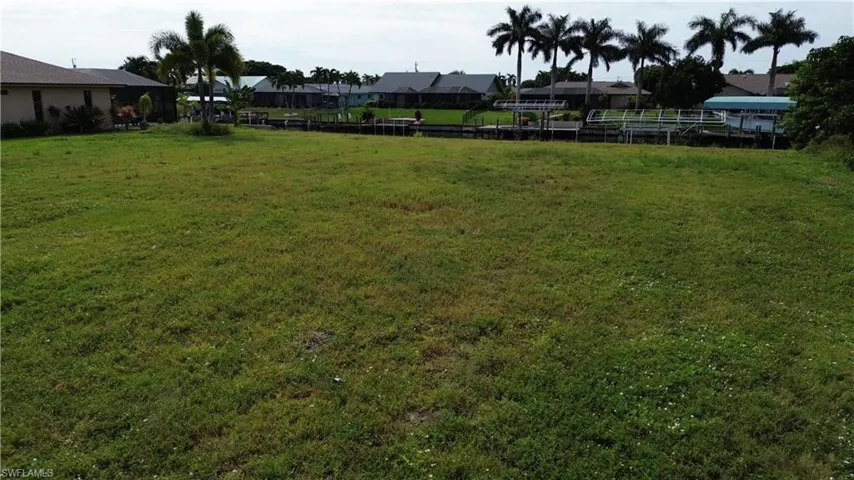 View of green lawn featuring a residential view