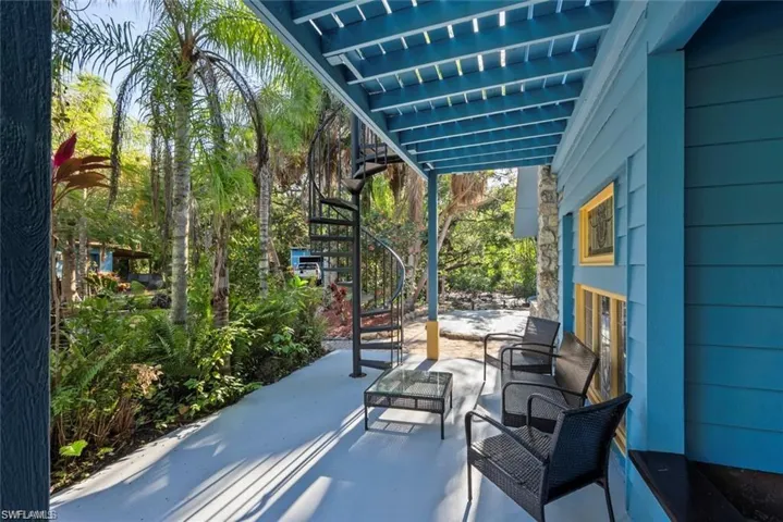 View of patio featuring stairway