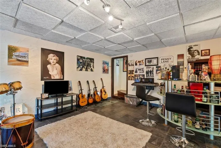 Living room with a dry bar and a textured wall