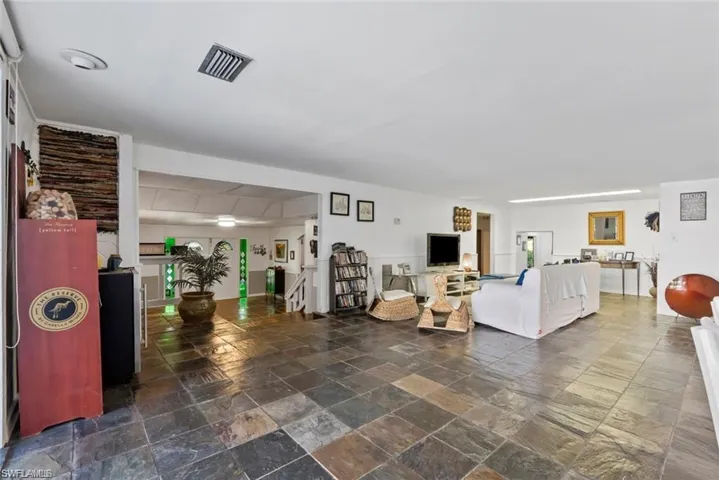 Living room with stone tile flooring