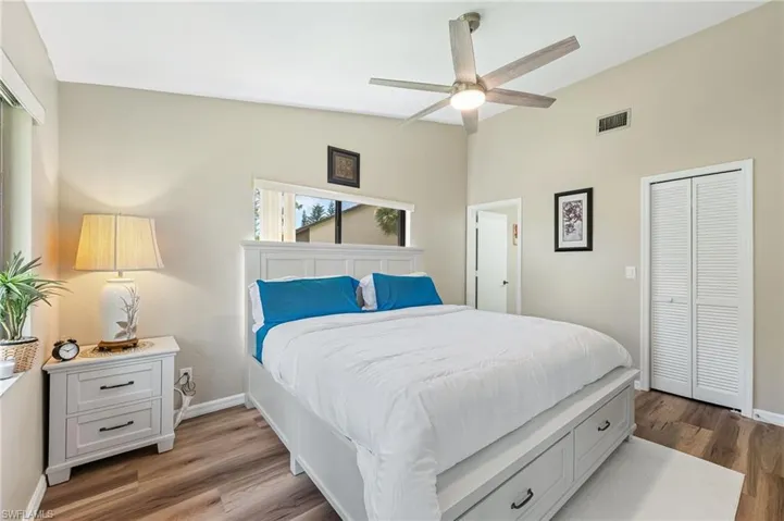 Bedroom featuring a closet, wood finished floors, and ceiling fan