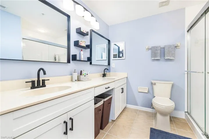 Dual vanity with undermount sinks and matte black fixtures