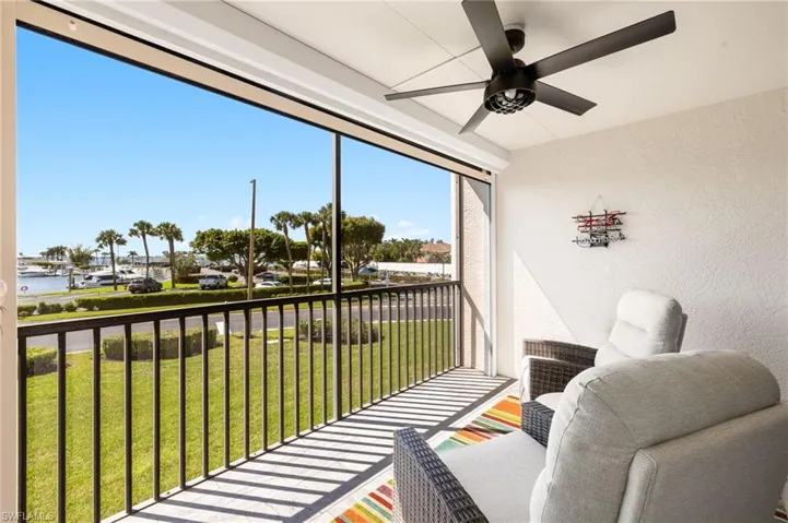 Sunroom featuring a ceiling fan