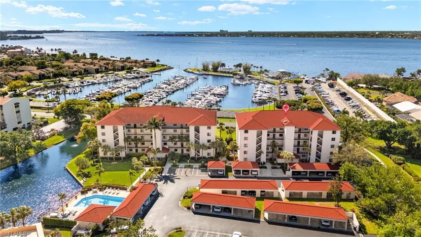 Birds eye view of property with a water view