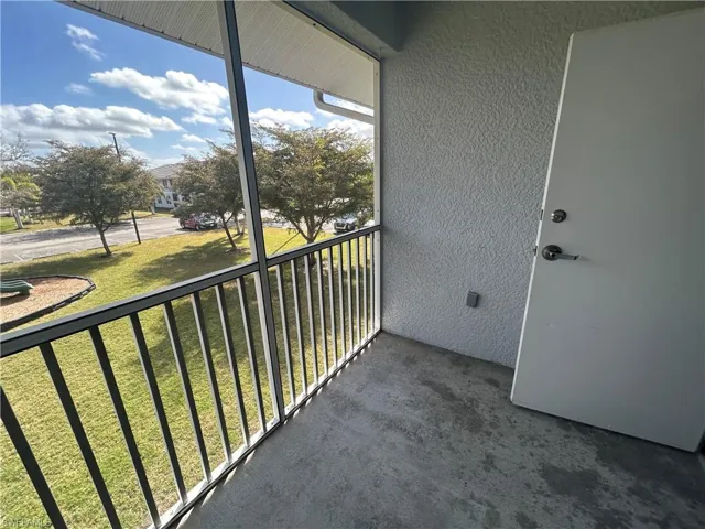 Balcony featuring a sunroom