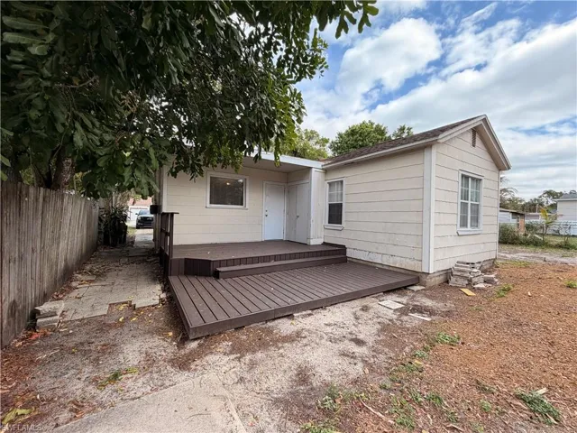 Rear view of house with a wooden deck