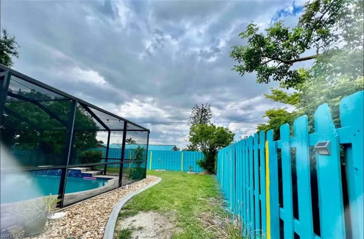 View of yard featuring a lanai