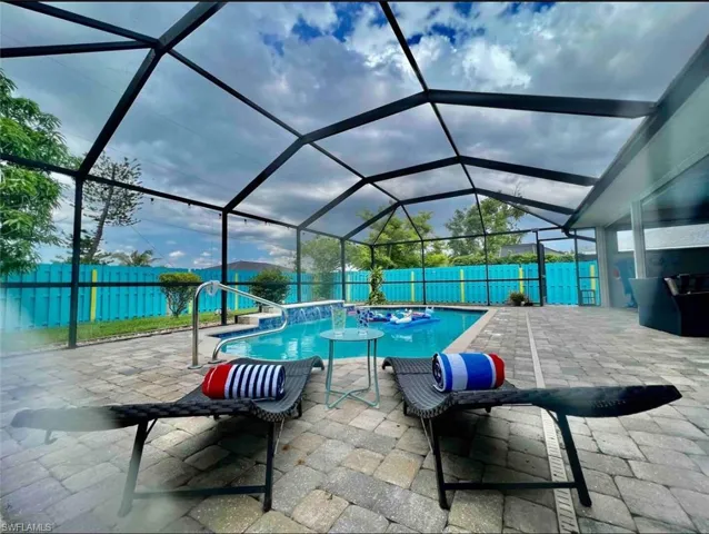 View of patio / terrace featuring a fenced backyard and a lanai