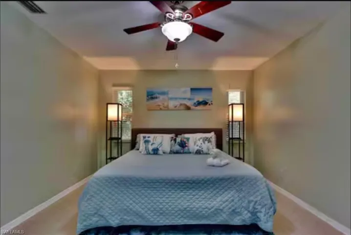 Bedroom with baseboards and ceiling fan