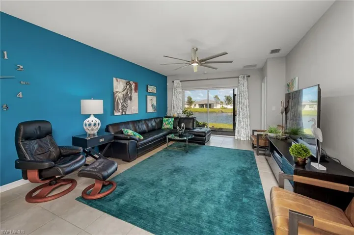 Tiled living room with ceiling fan