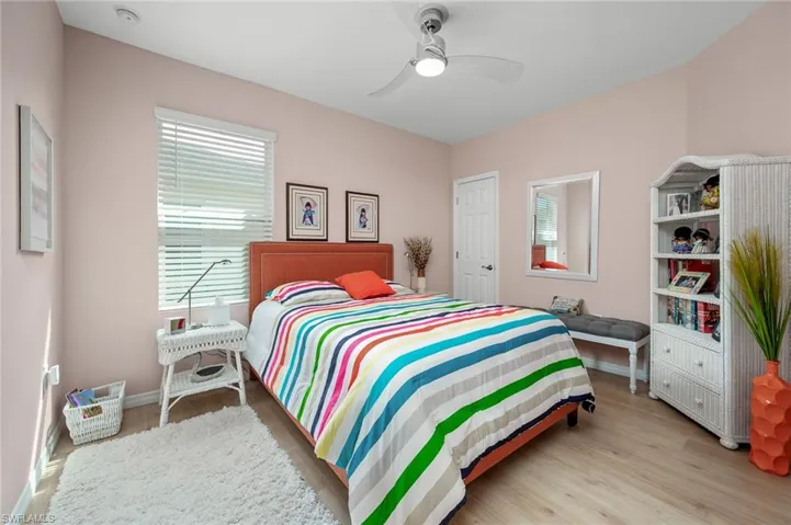 Guest Bedroom featuring light LVP floors and ceiling fan