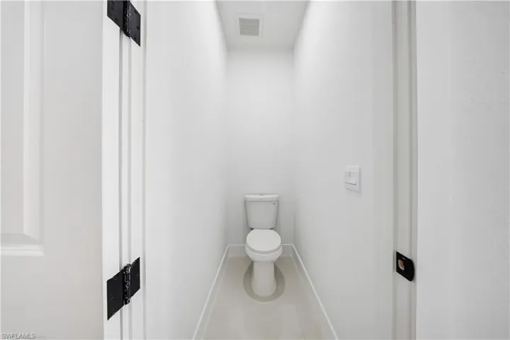 Bathroom featuring tile patterned flooring and toilet