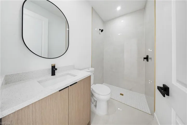 Bathroom featuring vanity and walk in shower