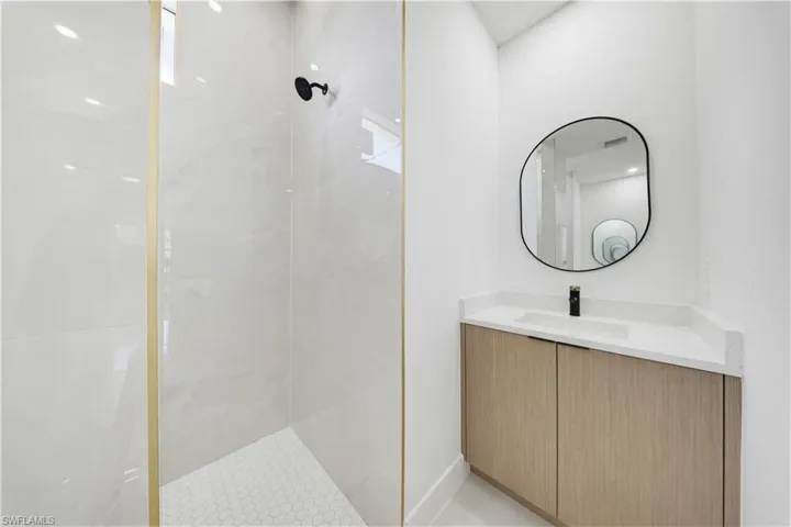 Bathroom featuring vanity and walk in shower