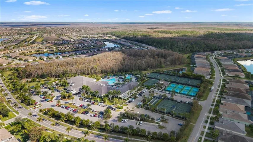 View of property location with a nearby body of water and nearby suburban area