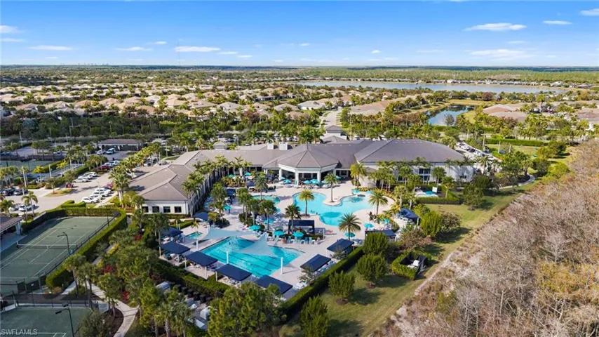 Aerial perspective of suburban area featuring a pool