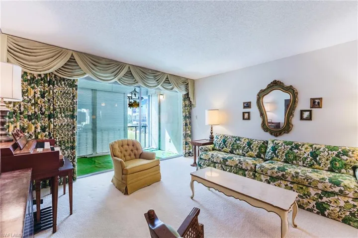 Wall-to-wall carpeting and a neutral wall color define this interior space