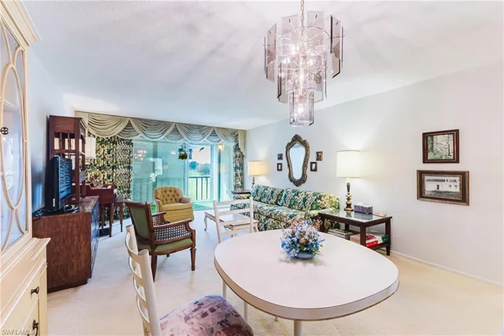 White walls and neutral carpeting provide a bright interior