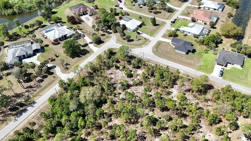 Aerial view of residential area featuring a large body of water