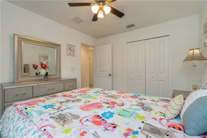 Bedroom with a closet and ceiling fan