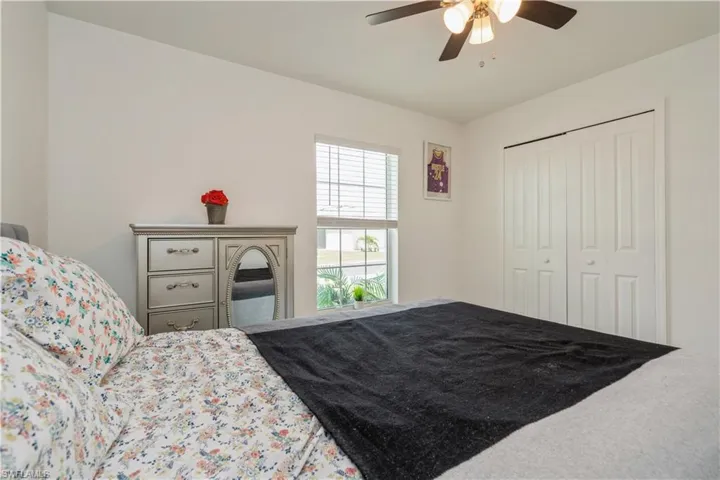 Bedroom featuring a closet and ceiling fan