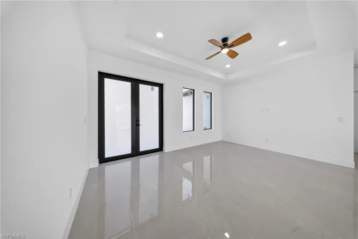 Spare room with a ceiling fan, french doors, and recessed lighting