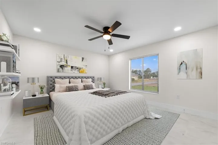 Master Bedroom featuring recessed lighting, ceiling fan, and light marble finish flooring
