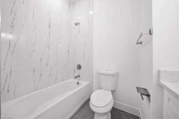 Full bathroom featuring vanity and shower / bath combination