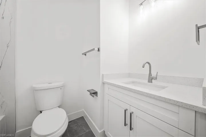 Full bath with vanity and a bathtub