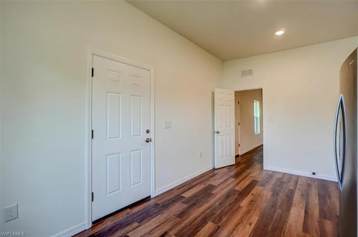 Entry to In Law Suite baseboards, visible vents, recessed lighting, and dark wood-type flooring