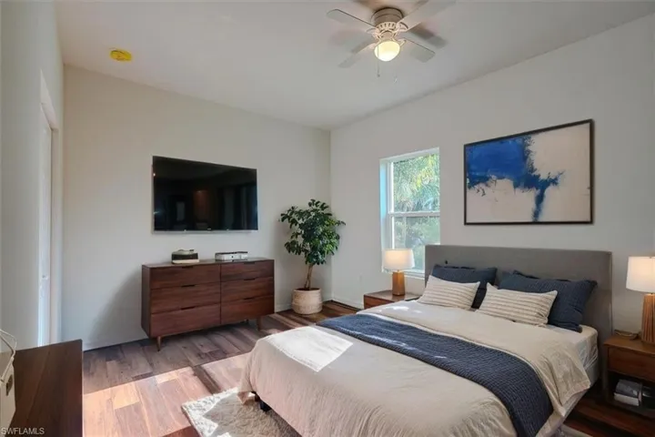 Bedroom with light wood-style flooring and ceiling fan